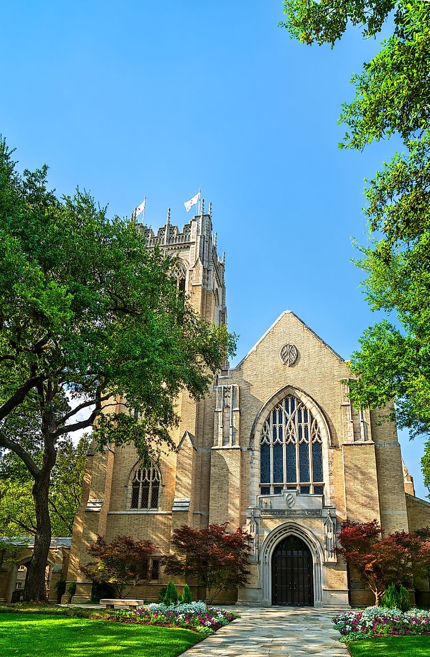 Gothic-style stone church building with a tall bell tower on the campus of Southern Methodist University in Dallas, Texas