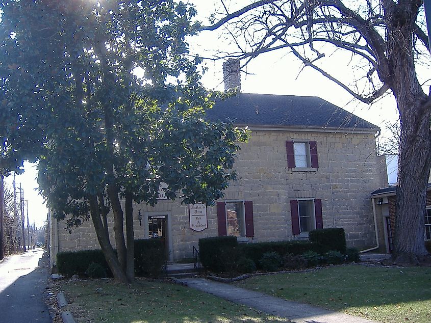 Old Nelson County Jail in Bardstown, Kentucky, a historic brick building with barred windows and a weathered facade, once housing prisoners in the heart of the town.