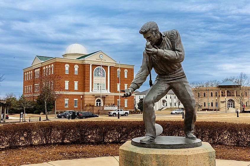 The Elvis Presley statue in Tupelo, Mississippi, depicting the iconic musician in a dynamic pose.