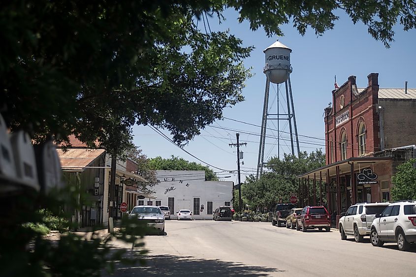 Downtown Gruene, Texas, featuring charming shops, the iconic water tower, and the historic dance hall, all reflecting the town's rustic and lively atmosphere.