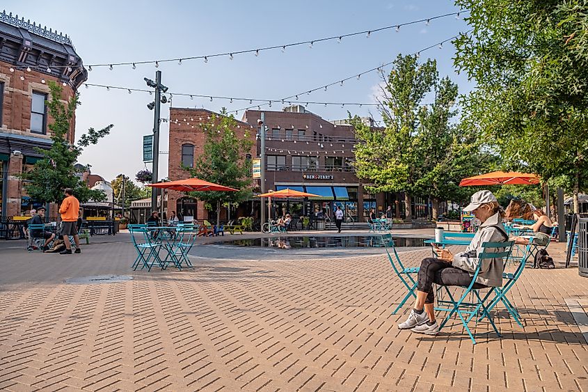  People hang out in the famous Old Town Square, in the center of Fort Collins. Editorial credit: Page Light Studios / Shutterstock.com