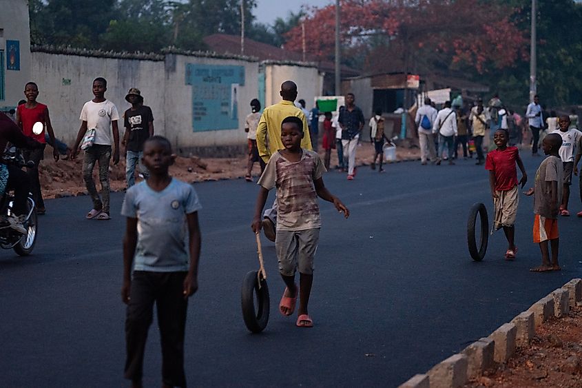 People march proudly on a newly rehabilitated road in Mbujimayi in DR Congo.