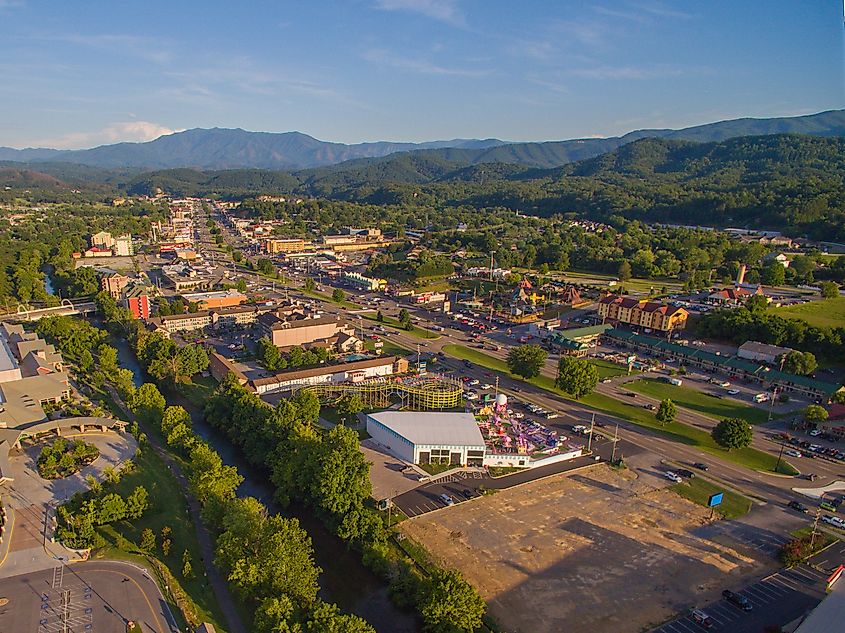 Aerial view of main strip, attractions, and mountains in Pigeon Forge, Tennessee.