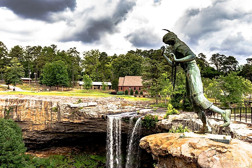 View of a statue and Noccalula Falls in Gadsden, Alabama.