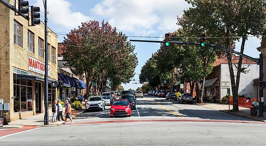 Wide-angle view of Main Street in Brevard, North Carolina, showing traffic and pedestrians.