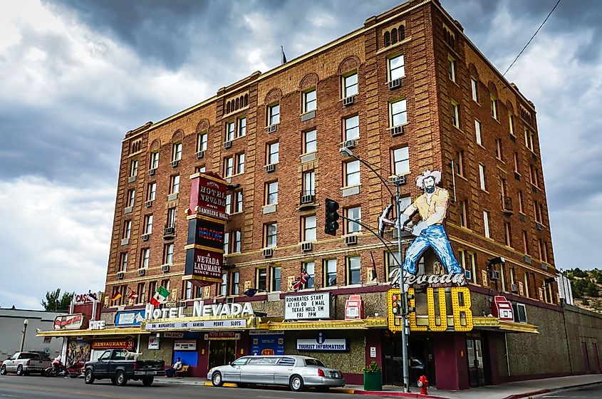 A stretch limousine is parked in front of the redbrick, Prohibition-era Hotel Nevada.