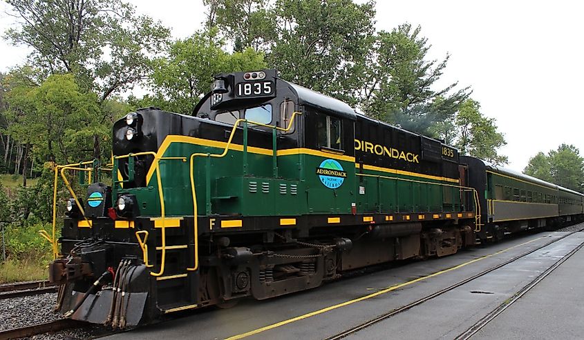 Vintage diesel locomotive engine pulls a passenger train at the Adirondack scenic railroad in Utica.