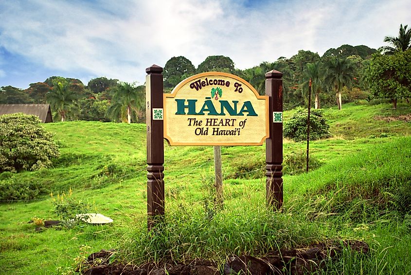 Sign welcoming visitors to the historic town of Hana following a winding scenic drive along Maui's coast.