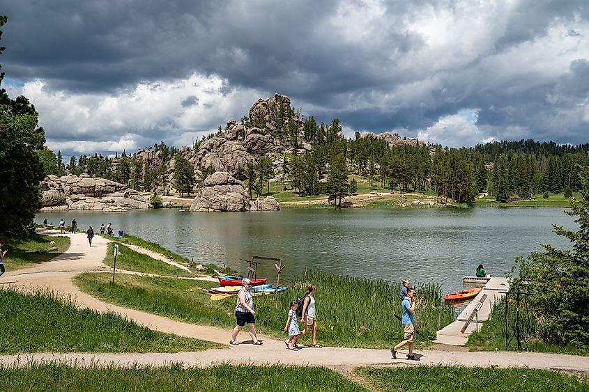 Families enjoy a summer day on Sylvan Lake, in Custer State Park