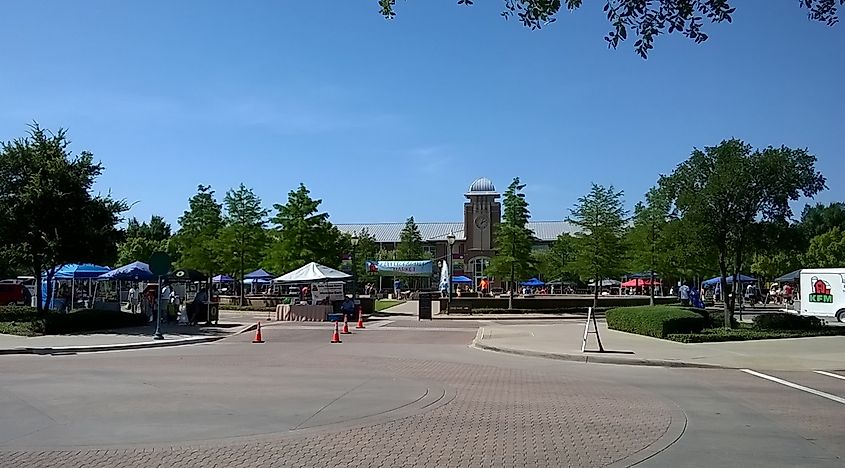 Stalls and shoppers at the Saturday Farmers Market in Keller, Texas