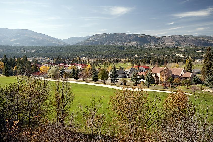 Village and golf course nestled beneath mountains in Radium Hot Springs, British Columbia.