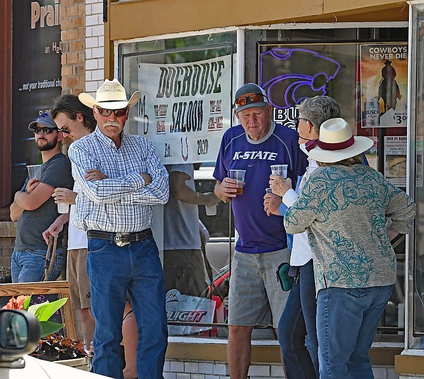 Locals gather outside Doghouse Saloon in Cottonwood Falls, KS