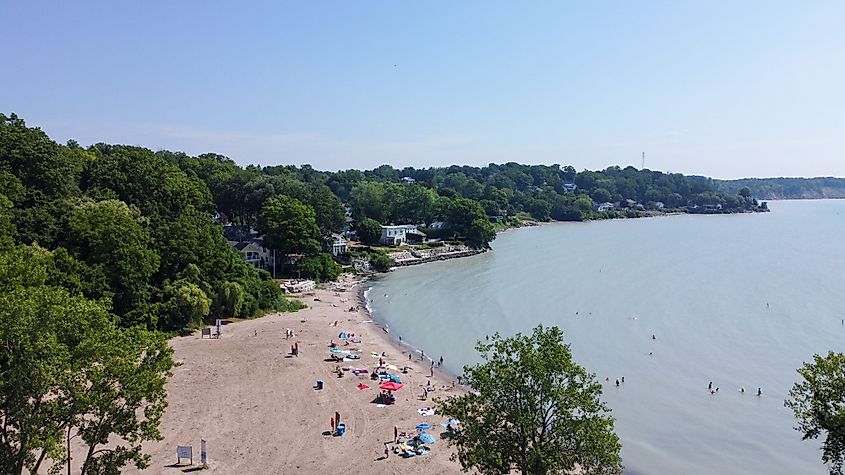 An aerial view of people vacationing on the sandy beach by Lake Erie in Port Stanley, Ontario, Canada.