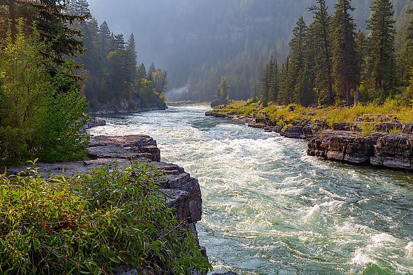 Snake River canyon near Jackson Hole, Wyoming with rugged terrain and flowing water.