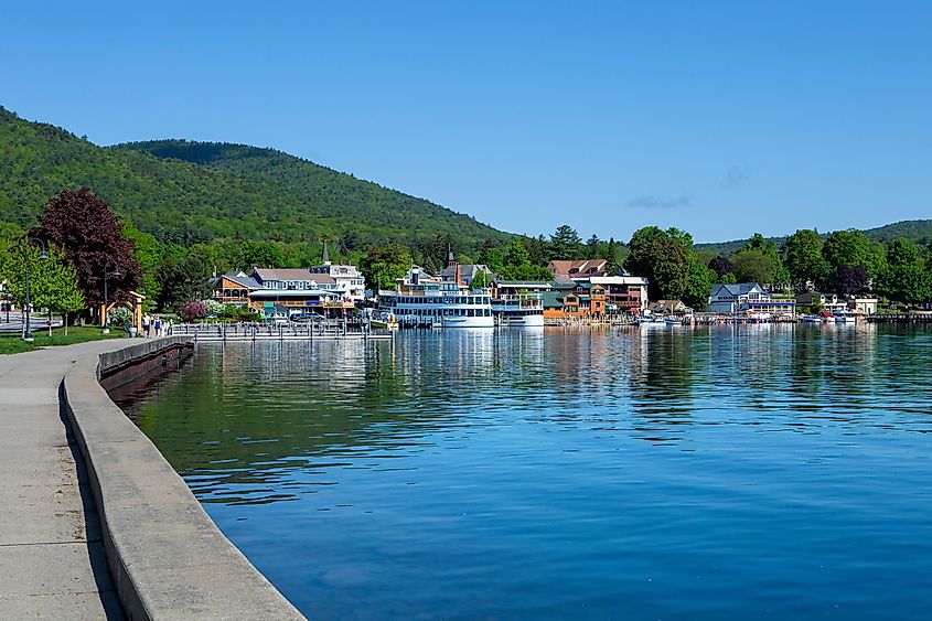 The calm waters of Lake George, New York and homes in the distance
