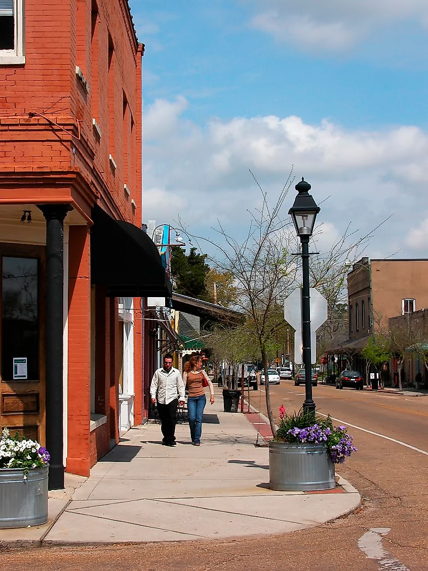 Covington, Louisiana, USA, couple strolling on Columbia Street. Editorial credit: Malachi Jacobs / Shutterstock.com