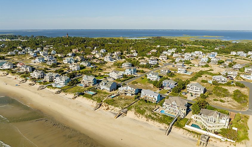 Beachfront properties lining Corolla Beach in North Carolina's Outer Banks, featuring a picturesque view of homes facing the Atlantic Ocean