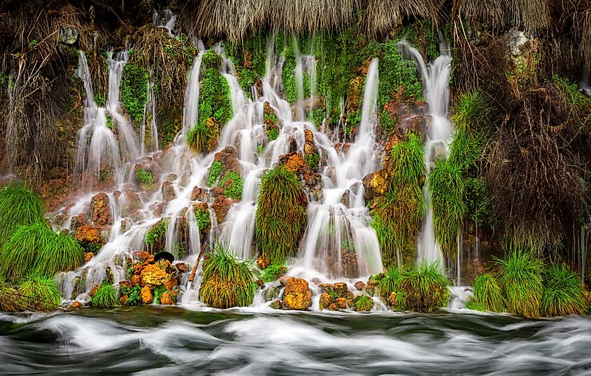 Waterfall at Thousand Springs State Park flowing into a river