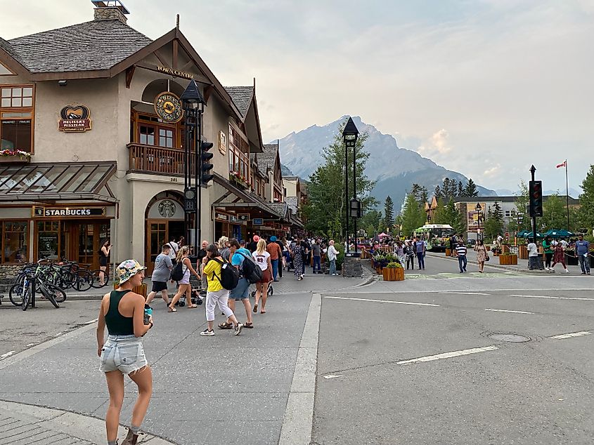 A popular crosswalk in the heart of Banff, Alberta. The nearly 10,000-foot Cascade Mountain stands guard in the backdrop.