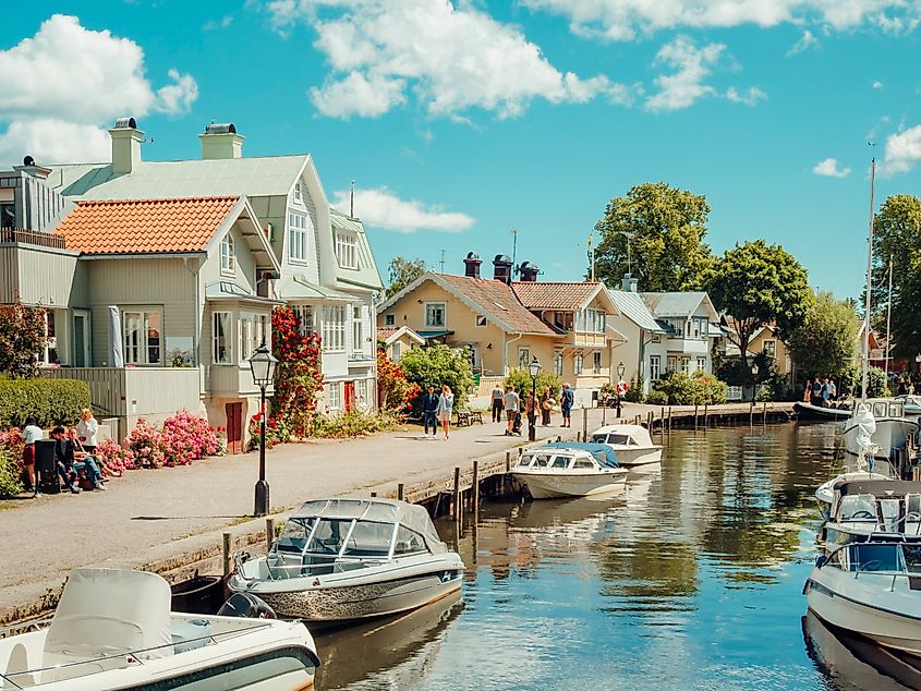 Touristic town Trosa, close to Stockholm city, with boats docked along the canal. Editorial credit: Nathalie Stolt / Shutterstock.com