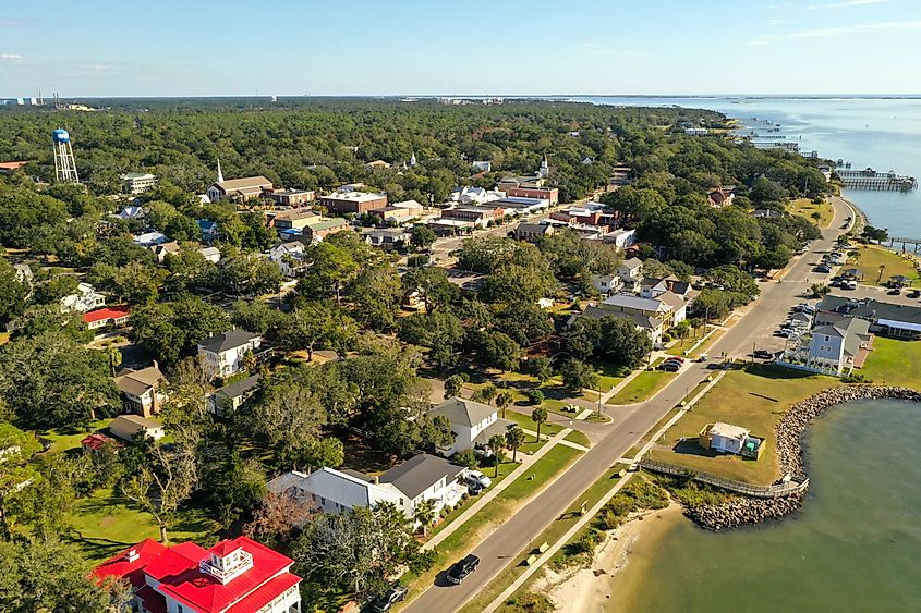 Waterfront restaurants and downtown view in Southport, North Carolina, located at the mouth of the Cape Fear River.