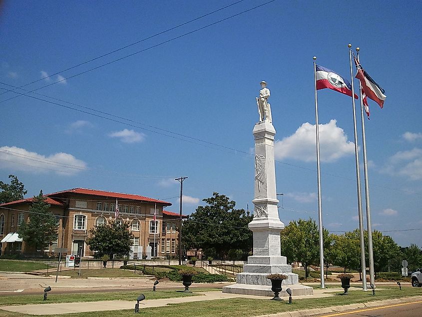 Rankin County Confederate Monument with historic courthouse in background