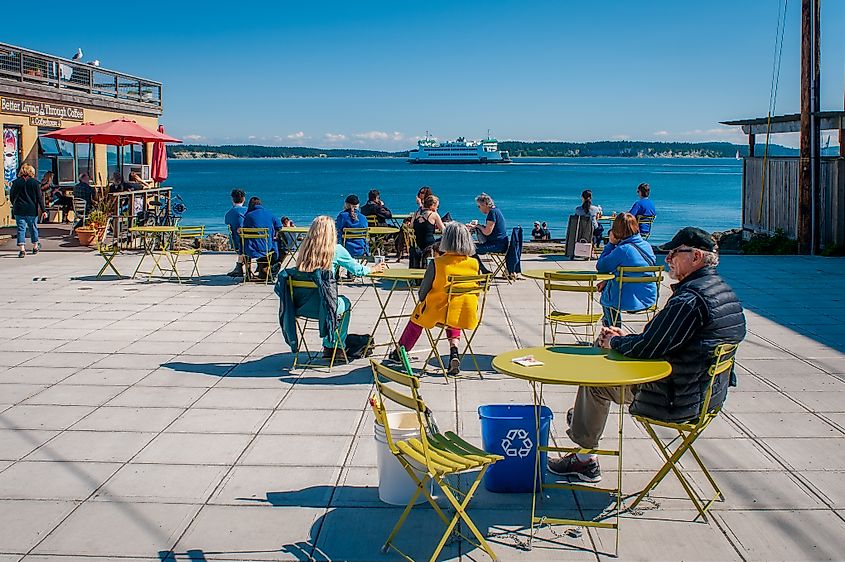 Washington State Ferry Kennewick steaming out of Port Townsend past Main Street Plaza with people enjoying a sunny day