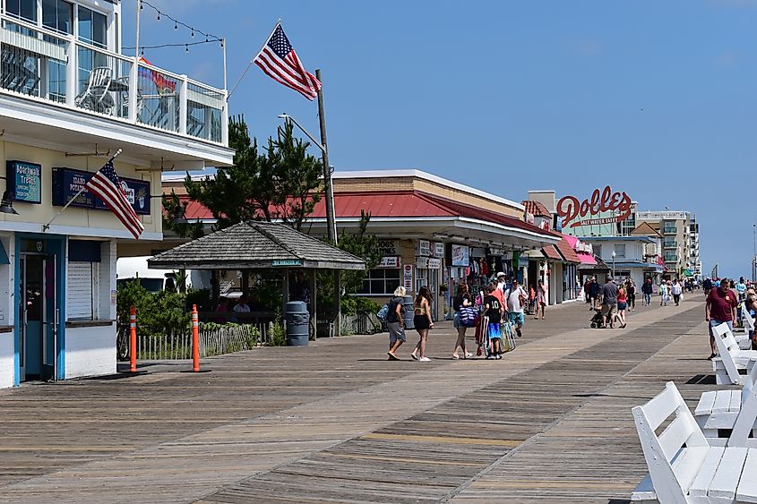 Rehoboth Beach, Delaware, USA - Shops along the boardwalk bustling with visitors.