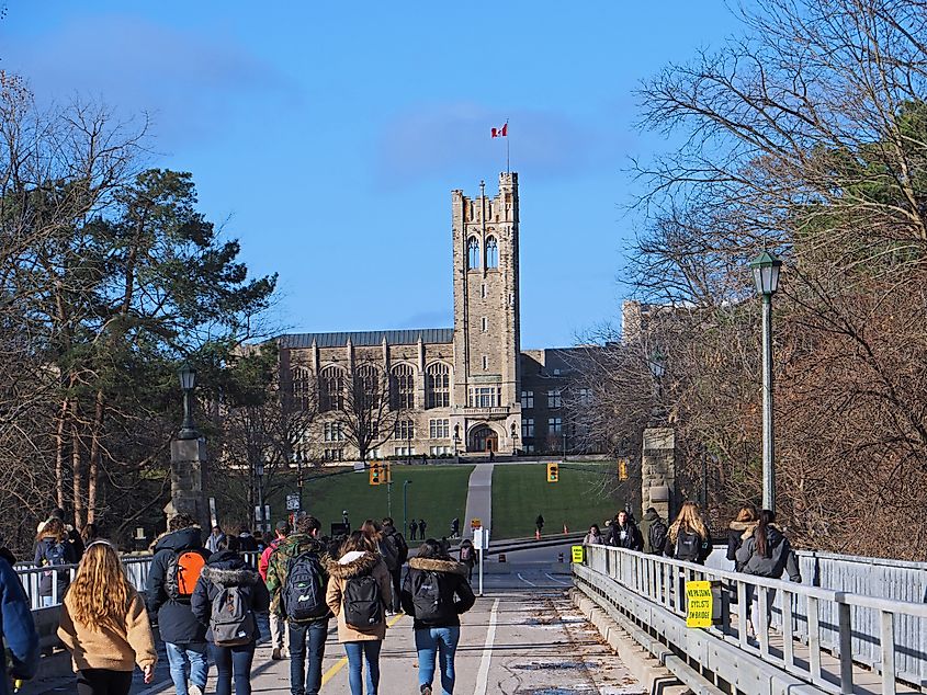 Students cross a bridge on their way to the campus of the University of Western Ontario.