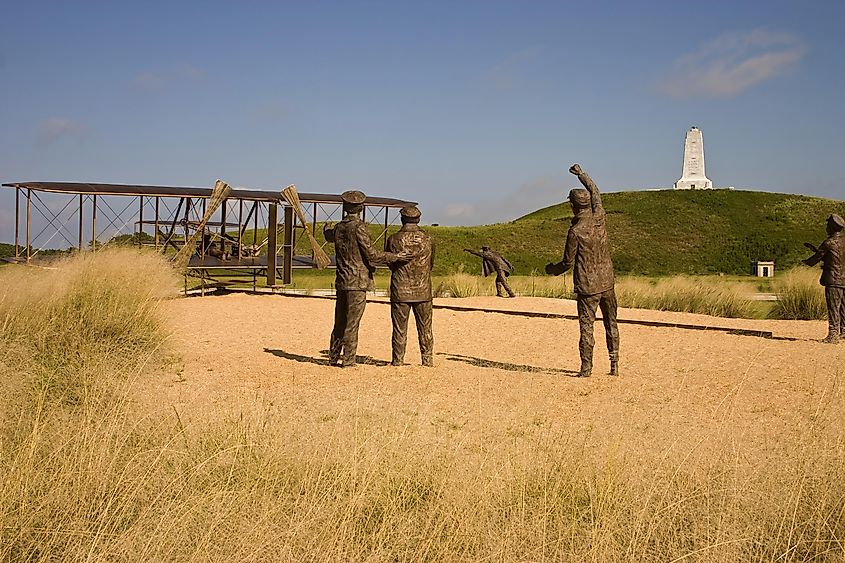 A bronze statue commemorating the first powered airplane flight by the Wright Brothers.