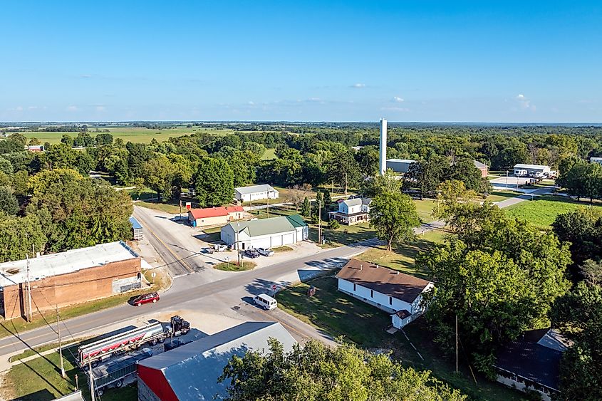 Aerial view of Dadeville Missouri with water tower in background and main street in foreground.