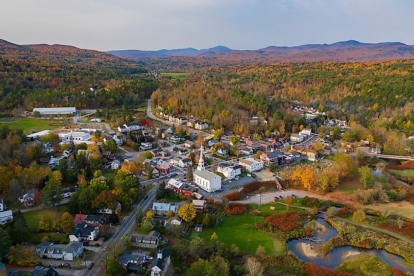 Aerial view of downtown Stowe, Vermont, showcasing the New England town’s autumn landscape with fall foliage colors.