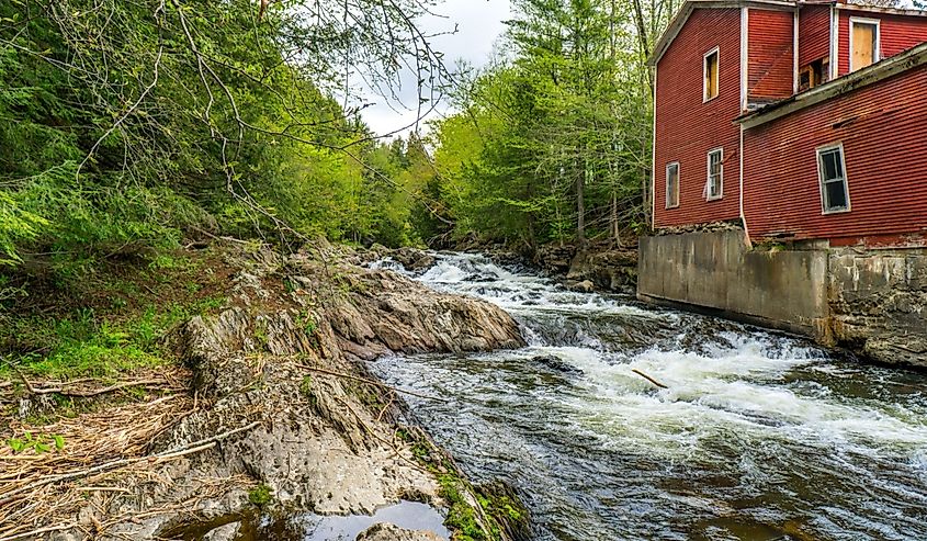 The Gihon River flows next to a former power house in Johnson, Vermont
