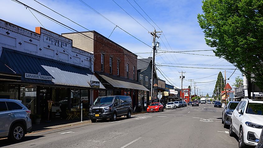 Cityscape view of Silverton, Oregon, showing parked cars along a street in Marion County during daytime.