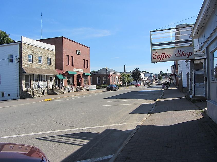 A view of Millinocket, Maine, showcasing the small-town charm with local homes, businesses, and scenic surroundings typical of this rural area near Baxter State Park.