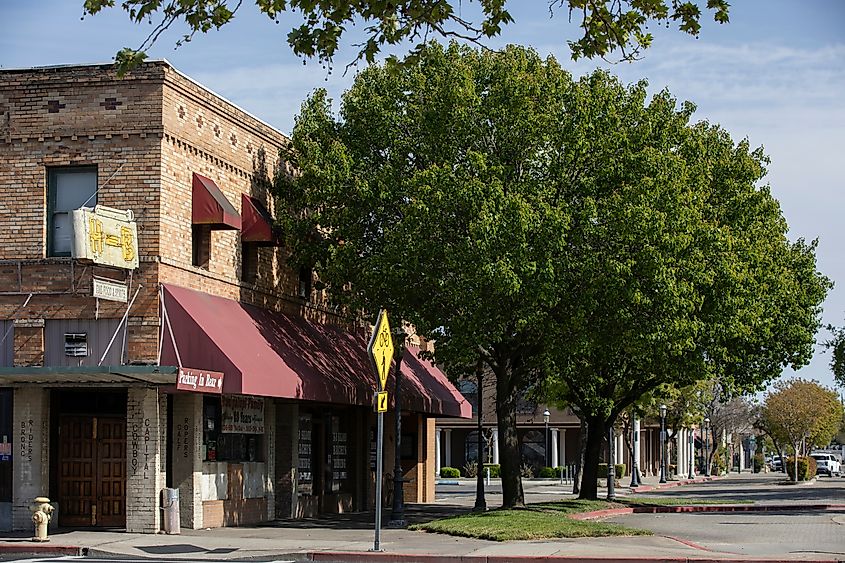 Afternoon sunlight shining on historic buildings in downtown Oakdale, California, USA