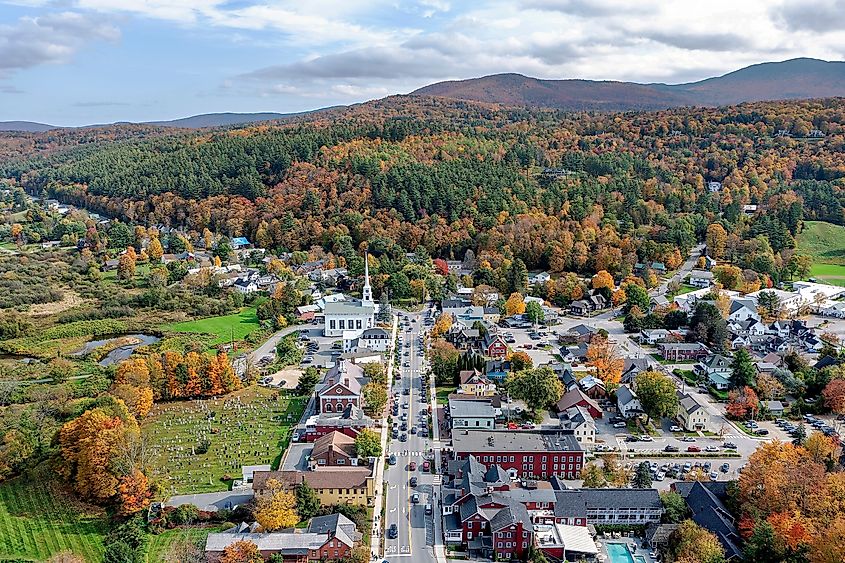 Aerial view of Stowe, Vermont, and the Green Mountains with autumn colors.