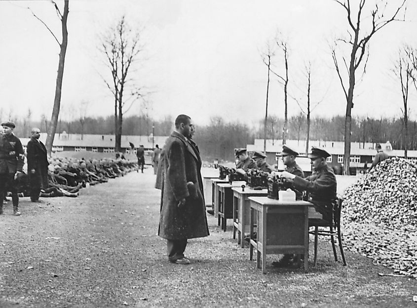 Gestapo officials performing the seemingly-mundane task of recording data on incoming prisoners at a German concentration camp.