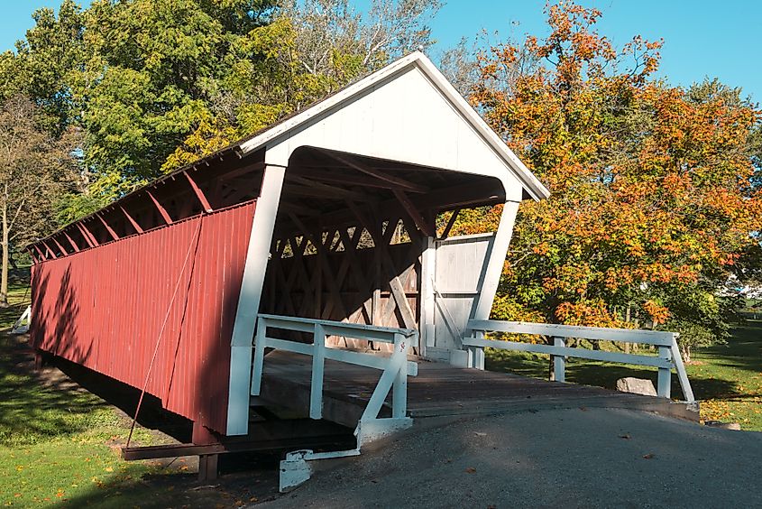 Covered bridge with fall foliage in Winterset, Iowa.