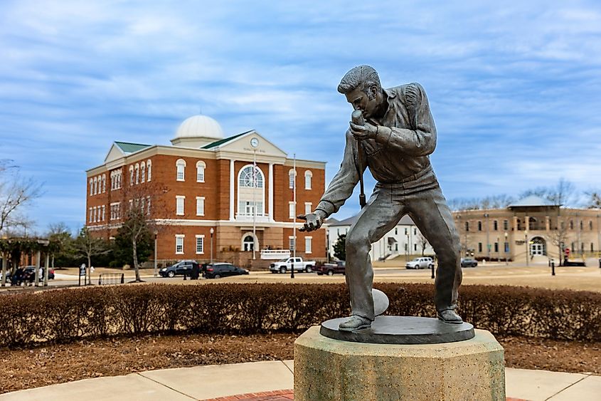 Elvis Presley Statue with Tupelo City Hall in the background in Tupelo, Mississippi