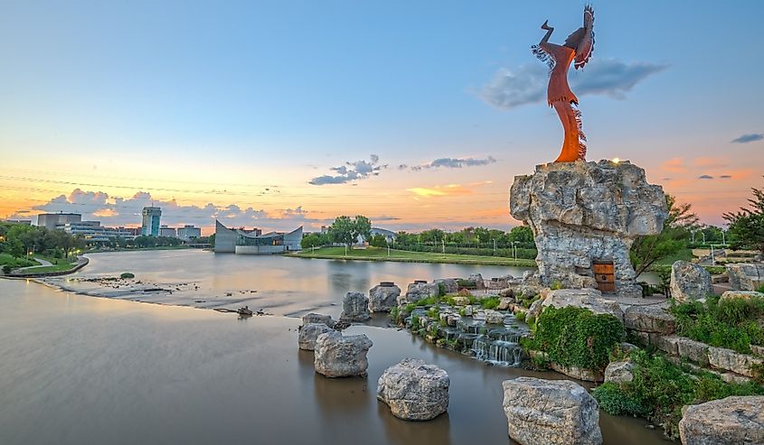 Downtown Wichita at dawn from the Arkansas River and Keeper of the Plains.