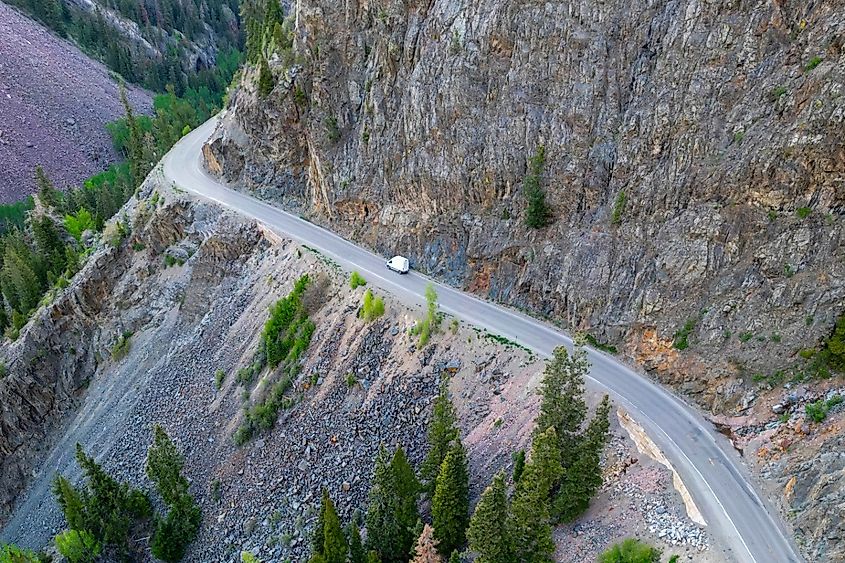 A lone vehicle drives along the dangerous Million Dollar Highway at Ouray, Colorado.