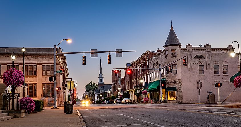 Scarce traffic on Main Street in downtown Woodford county's Versailles, KY, during sunrise.