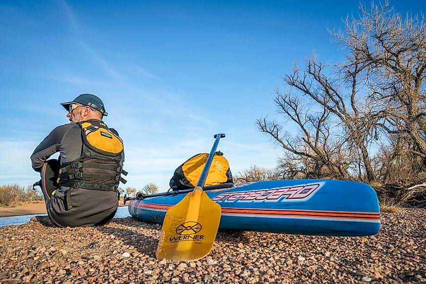 Older man prepares to enter the South Platte River near Kersey.