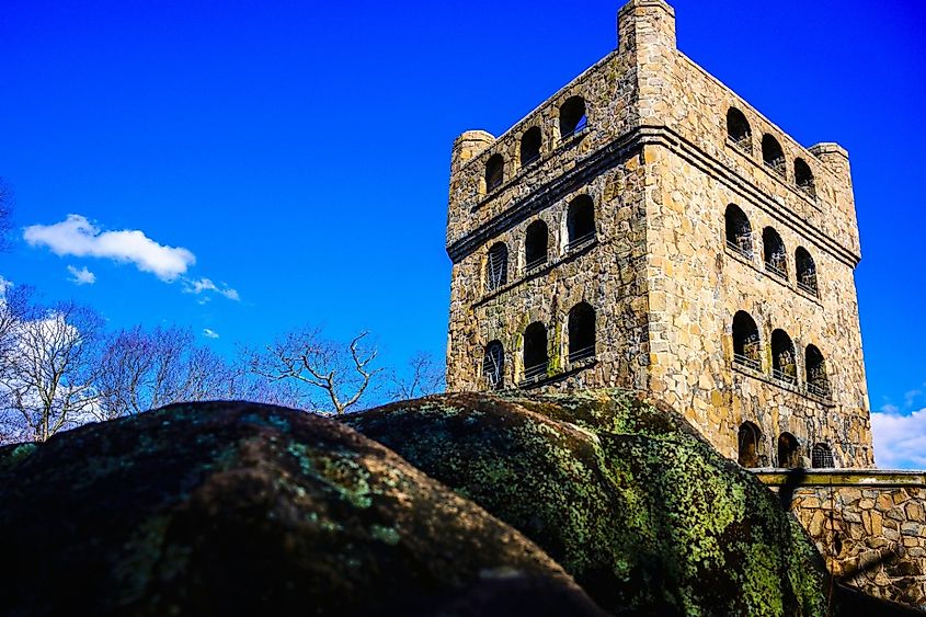 Sleeping Giant Observation Tower over the mossy rocks at the top of Mt. Carmel in Hamden, Connecticut.