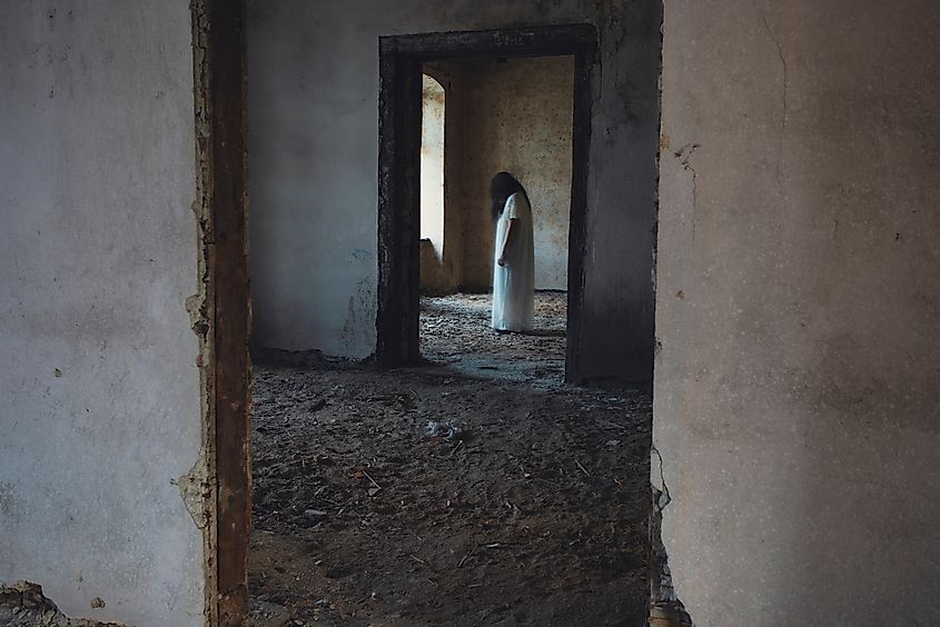 Haunted woman in an abandoned building.