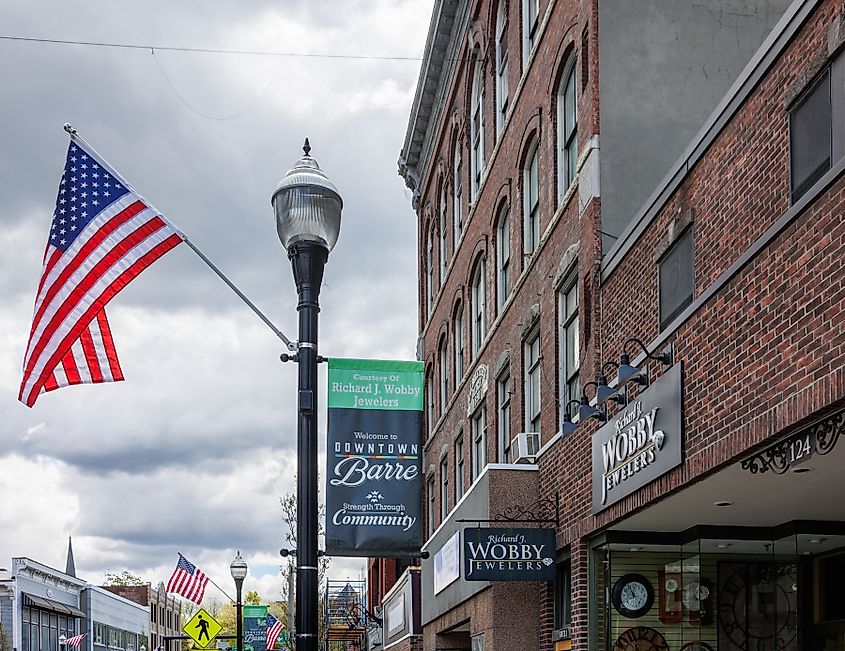 Downtown Barre, Vermont, featuring Main Street with historic brick buildings, local shops, and a bustling small-town atmosphere.