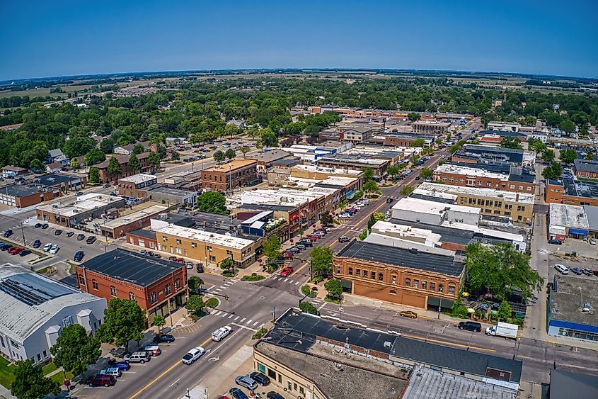 Aerial view of Brookings, South Dakota, showcasing the college town with green spaces, campus buildings, and residential areas during summer.