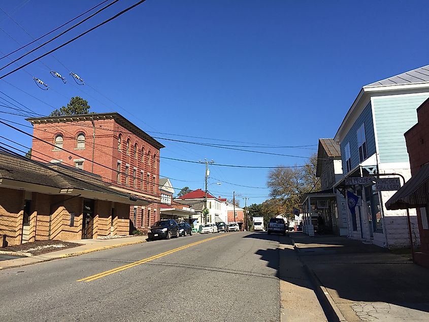 View of the Urbanna, Virginia, historical district from Cross Street, featuring charming historic buildings and a small-town atmosphere.