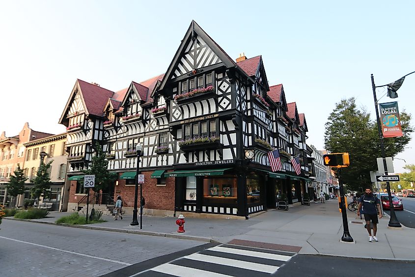 A vibrant streetscape featuring a Tudor-style building in Princeton, New Jersey.